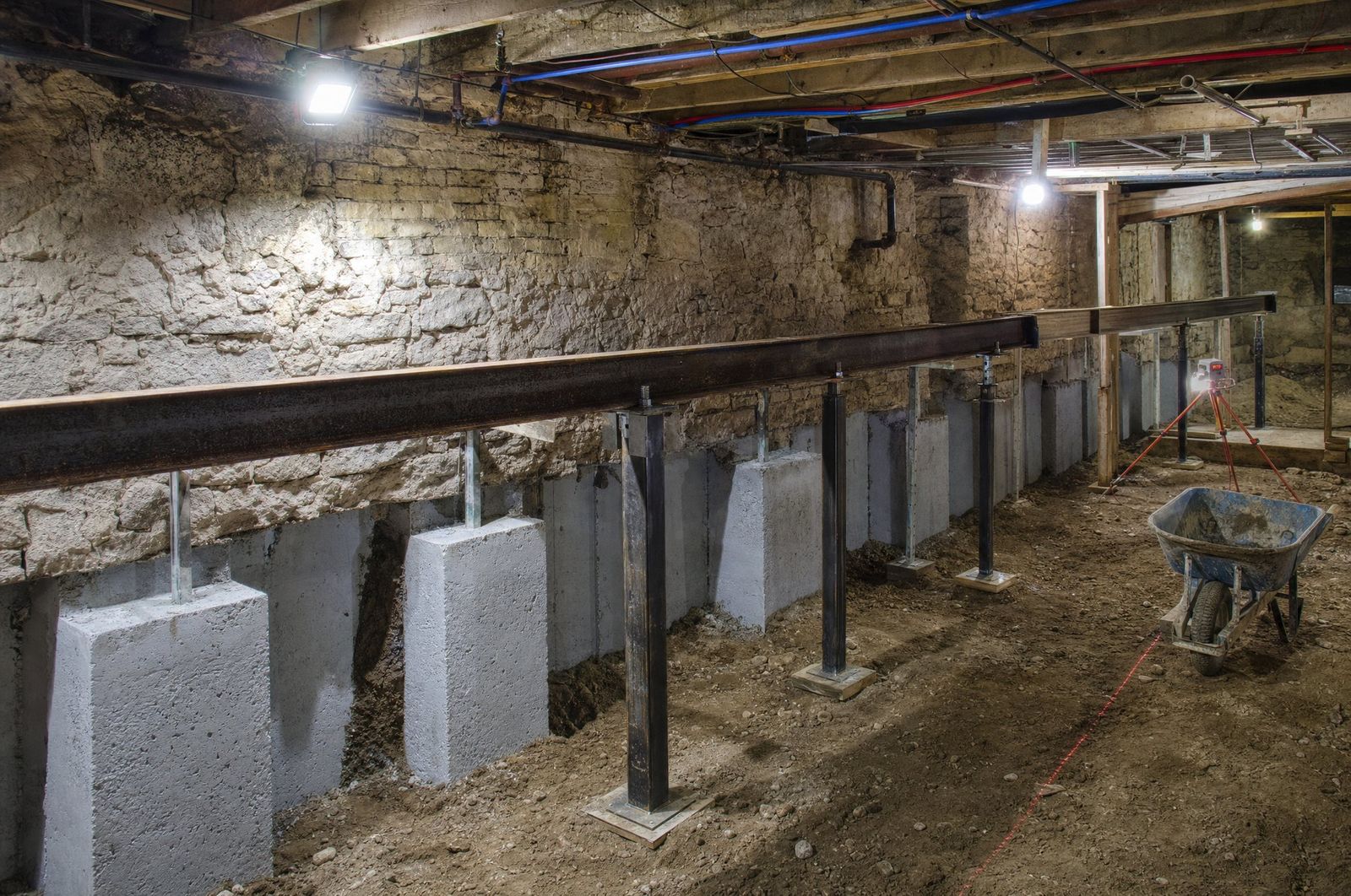 A basement being underpinned in engineered sections, concept imagery