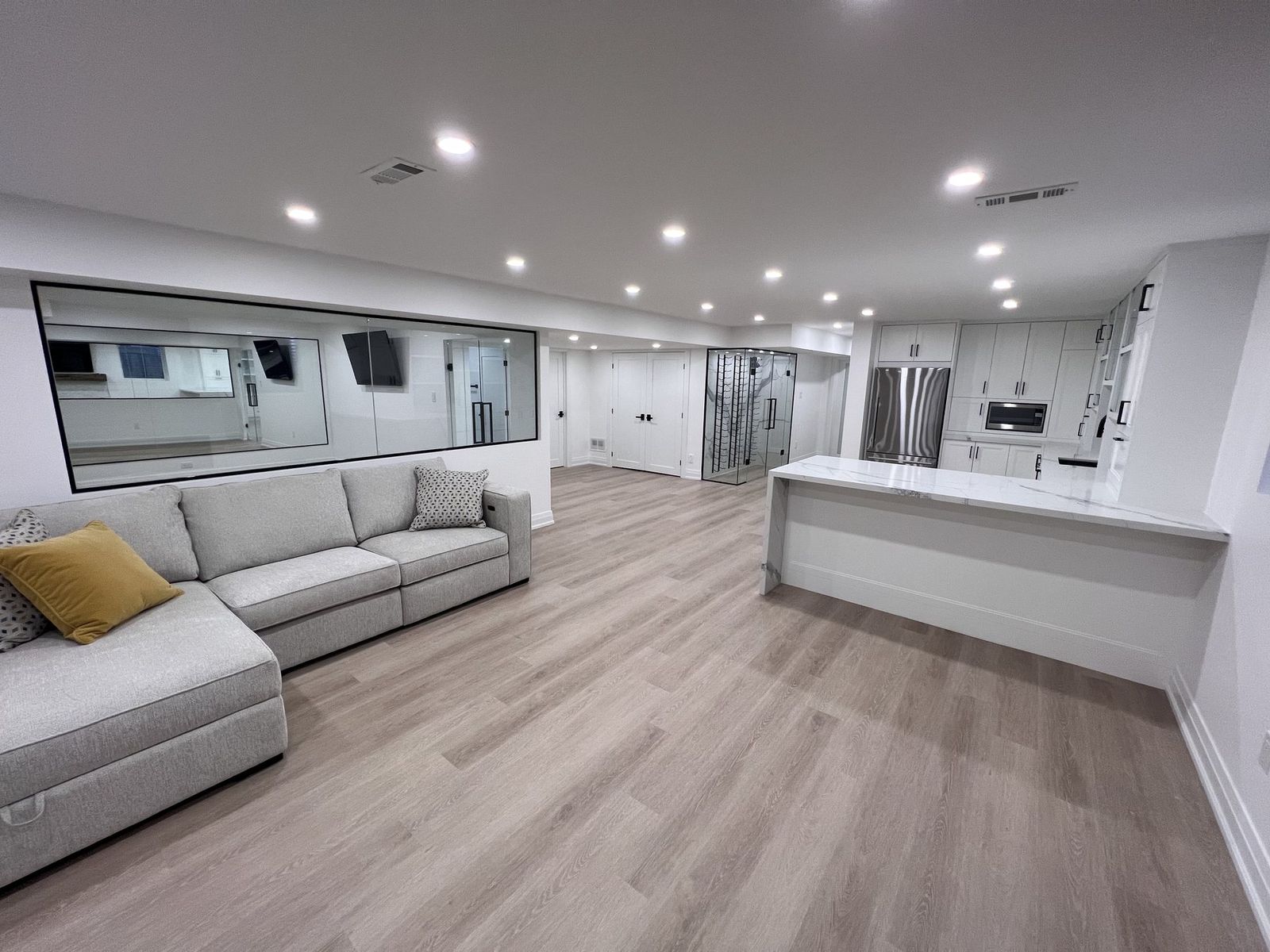 A finished lowered basement with full ceiling height